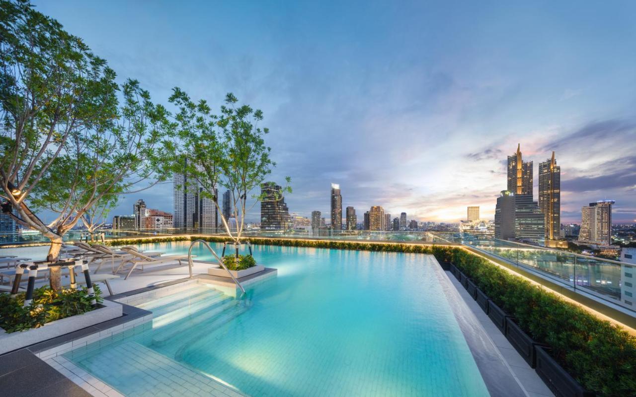 Hotel Grande Centre Point Surawong Bangkok Exterior foto The rooftop pool at The River